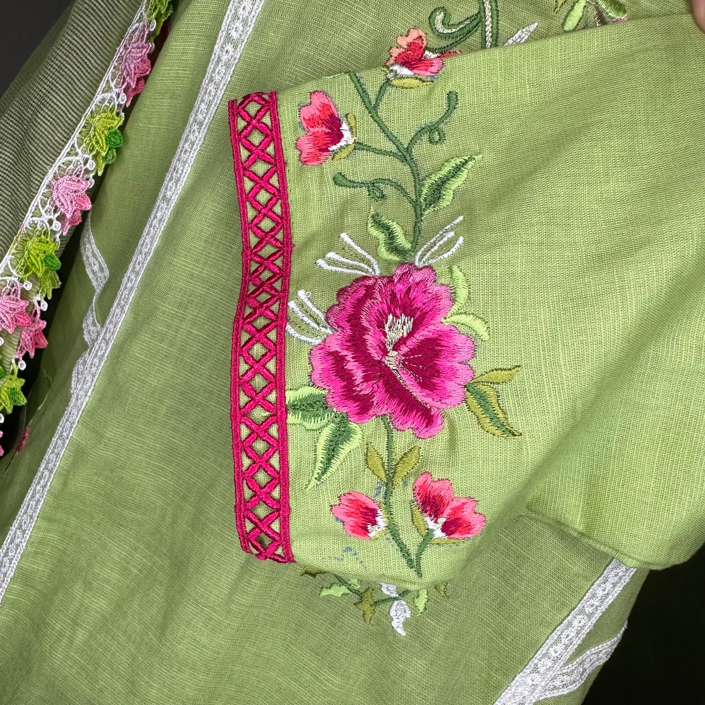 Green Pure linen cotton beautifully designed with elegant lacing and overall embroidery Stitched Suit